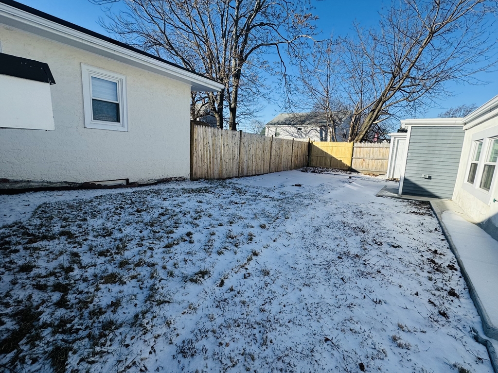 73 Victoria Street Revere, MA 02151 - Photo 3 of 24 a backyard of a house