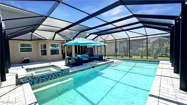 a view of swimming pool with a patio