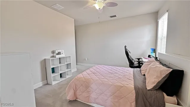 a bedroom with a bed and a cabinets