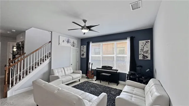a living room with furniture and a window