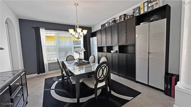 a dining room with furniture and window