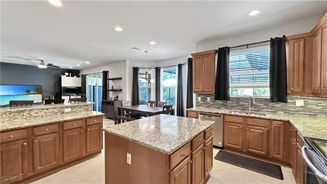 a kitchen with sink stove and cabinets
