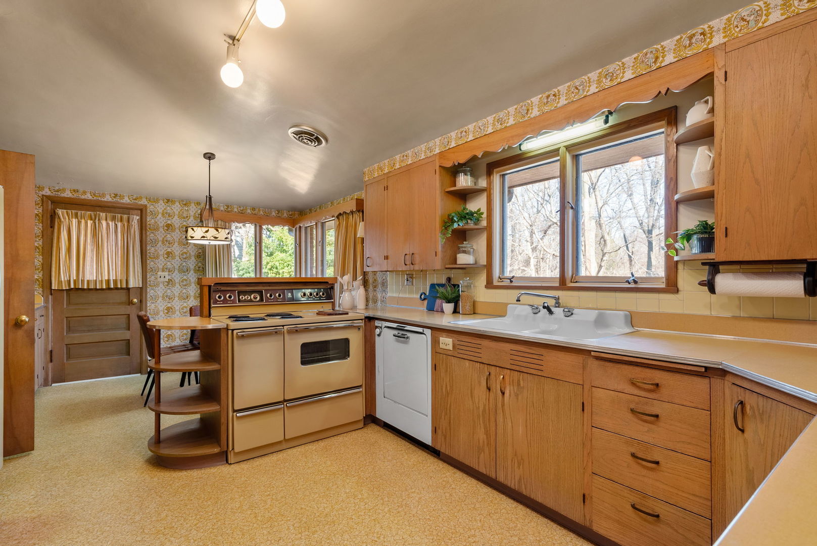 3108 26th Street Moline, IL 61265 - Photo 16 of 62 a kitchen with a sink stove and cabinets