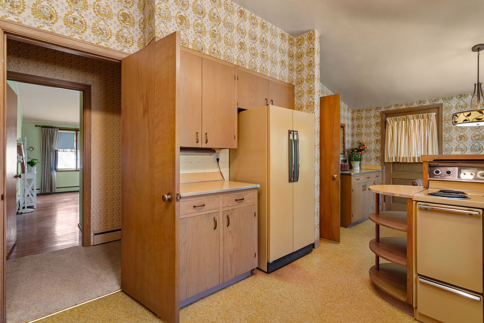 3108 26th Street Moline, IL 61265 - Photo 17 of 62 a view of a kitchen with refrigerator and windows
