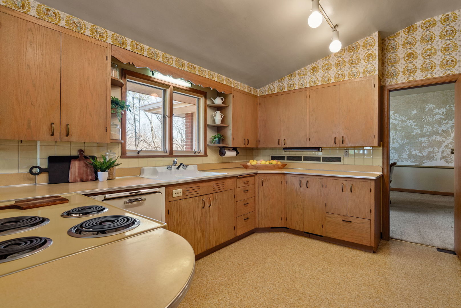 3108 26th Street Moline, IL 61265 - Photo 18 of 62 a kitchen with a stove a sink and a microwave
