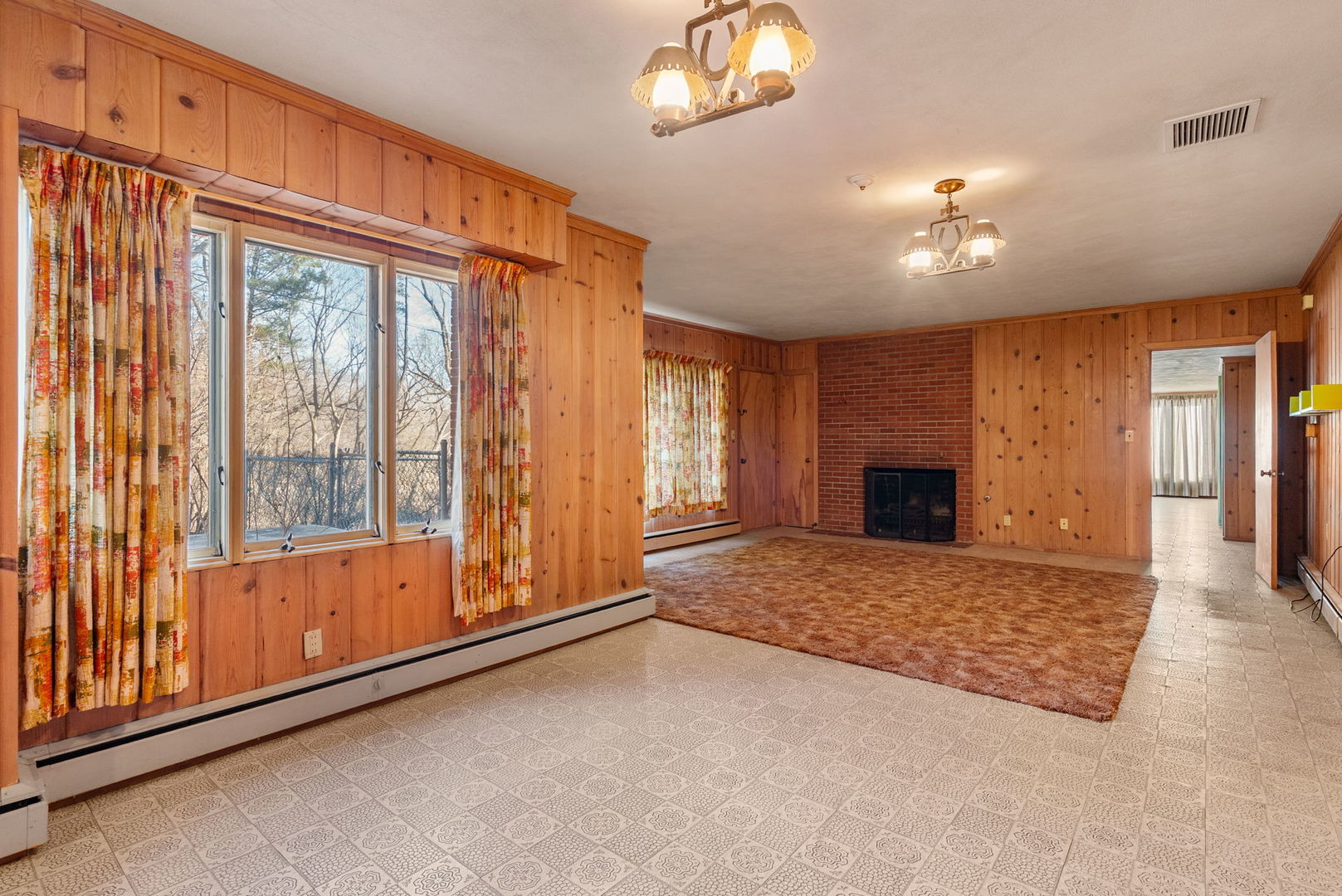 3108 26th Street Moline, IL 61265 - Photo 36 of 62 a view of an empty room with a fireplace and a window