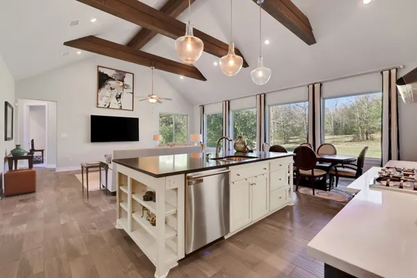 a kitchen with a sink and stove