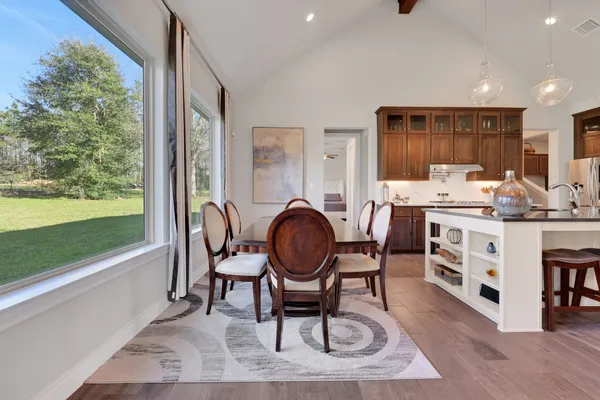 a kitchen with stainless steel appliances a sink stove and cabinets