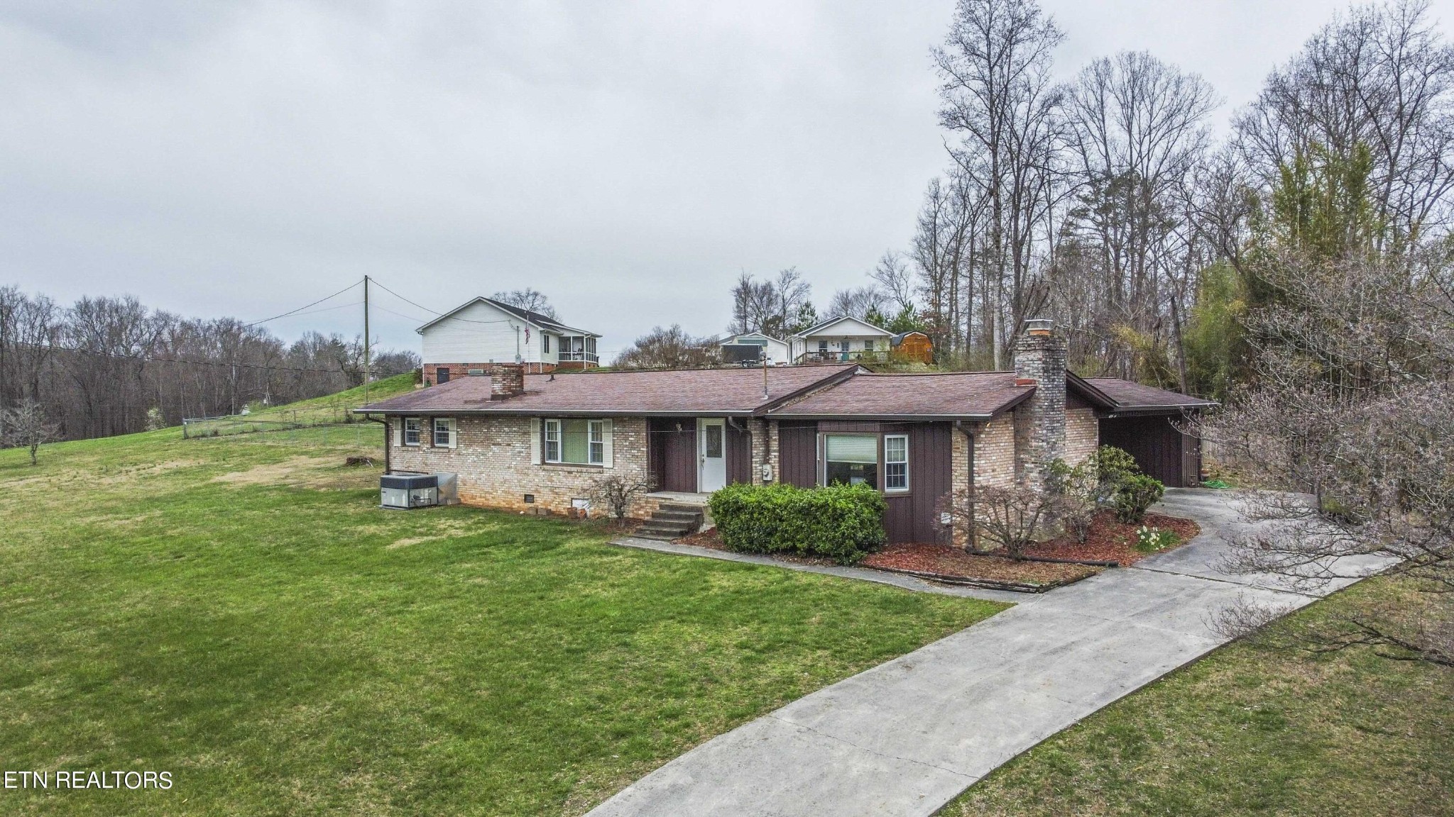 1280 Laurel Road Clinton, TN 37716 - Photo 1 of 36 a view of a house with yard and a garden