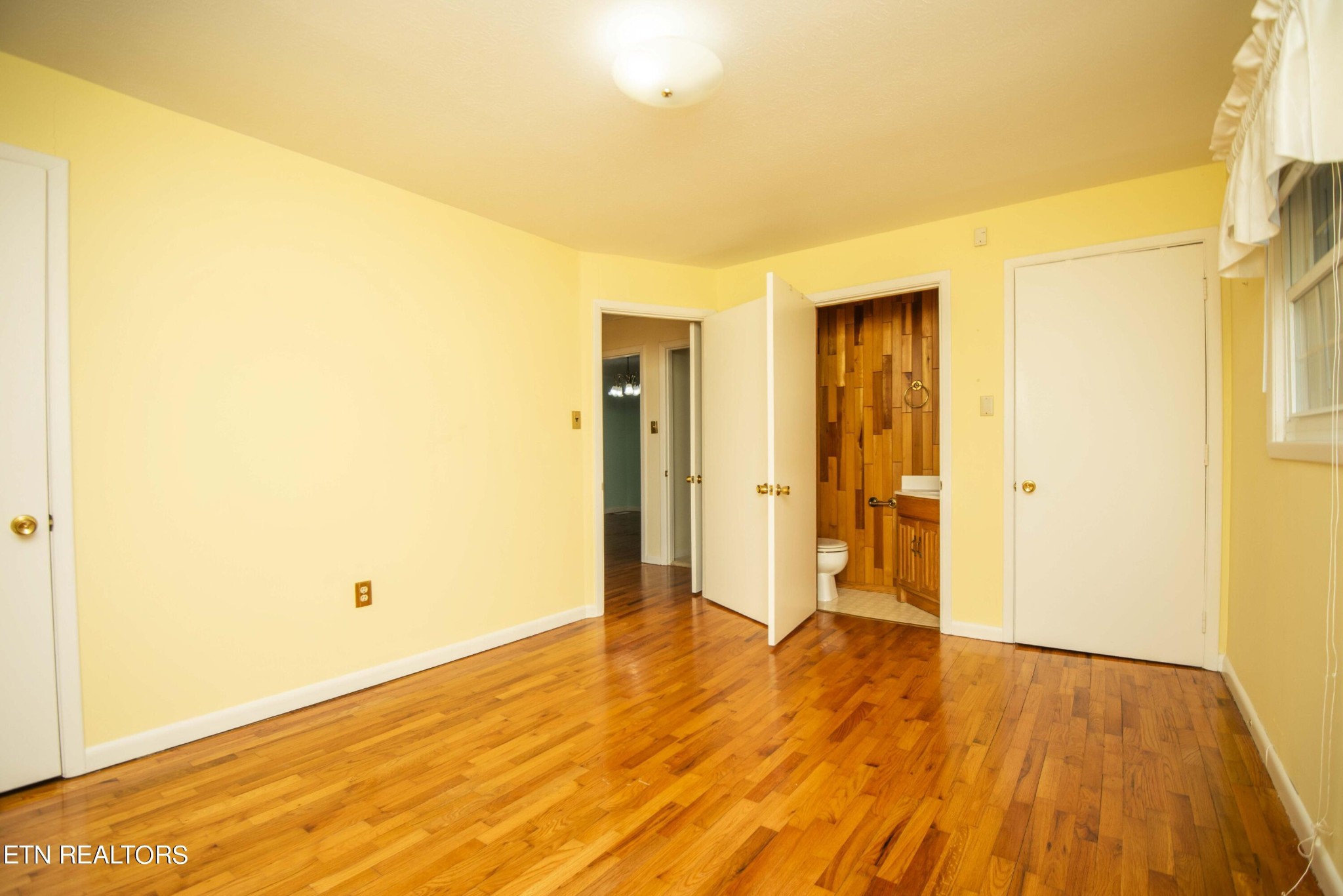 1280 Laurel Road Clinton, TN 37716 - Photo 22 of 36 a view of an empty room with wooden floor