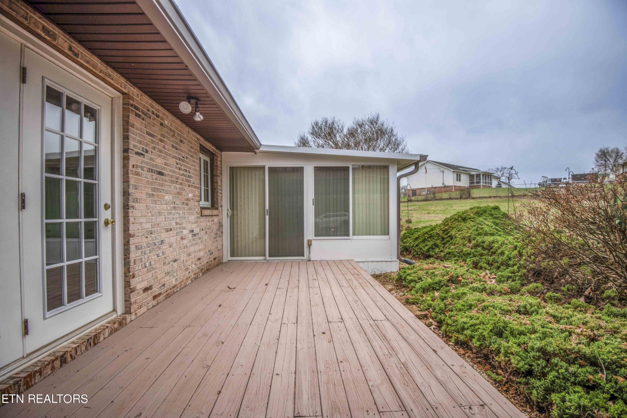 1280 Laurel Road Clinton, TN 37716 - Photo 28 of 36 a view of backyard with plants and wooden floor