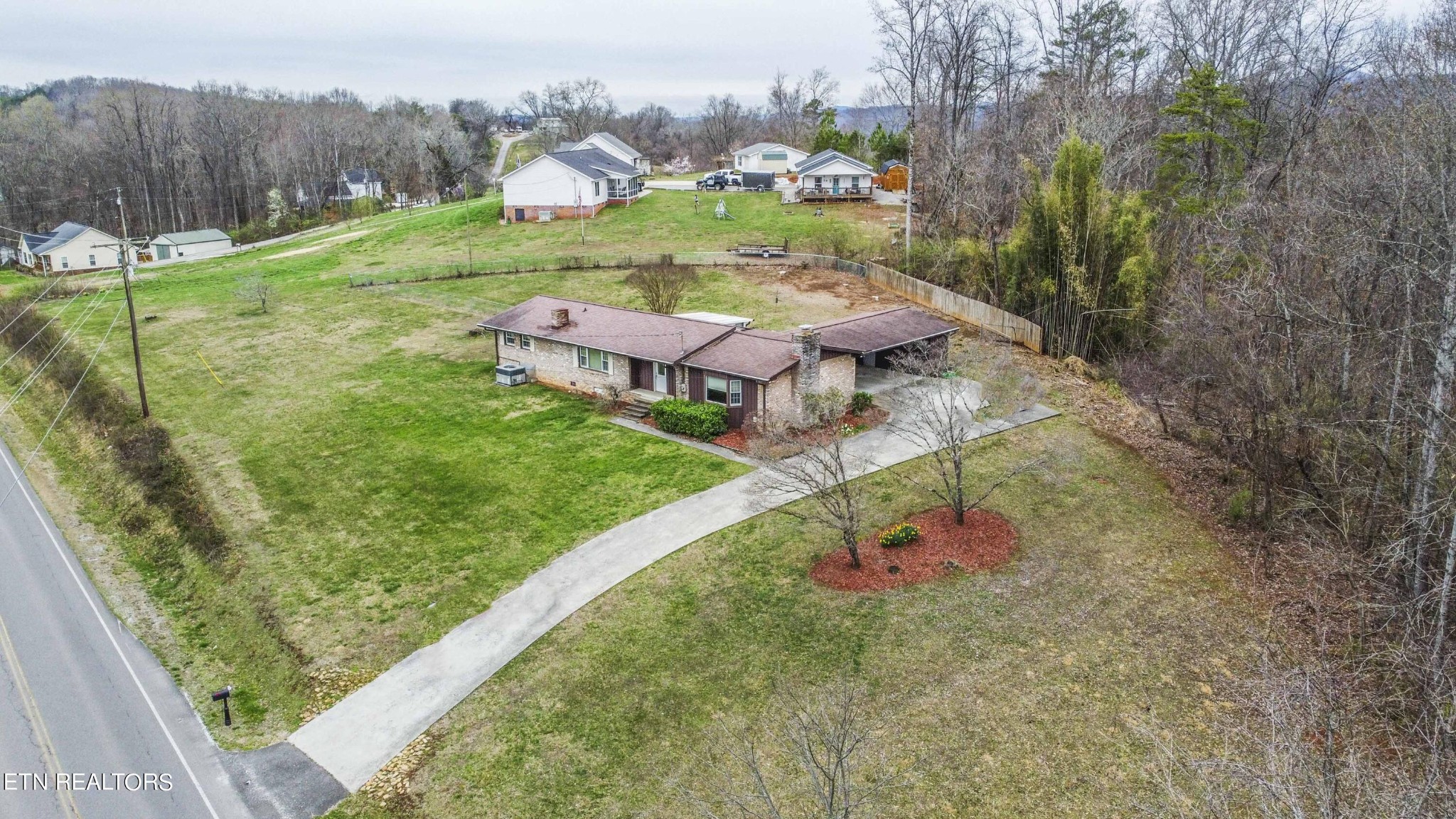 1280 Laurel Road Clinton, TN 37716 - Photo 3 of 36 a view of a garden with an outdoor seating
