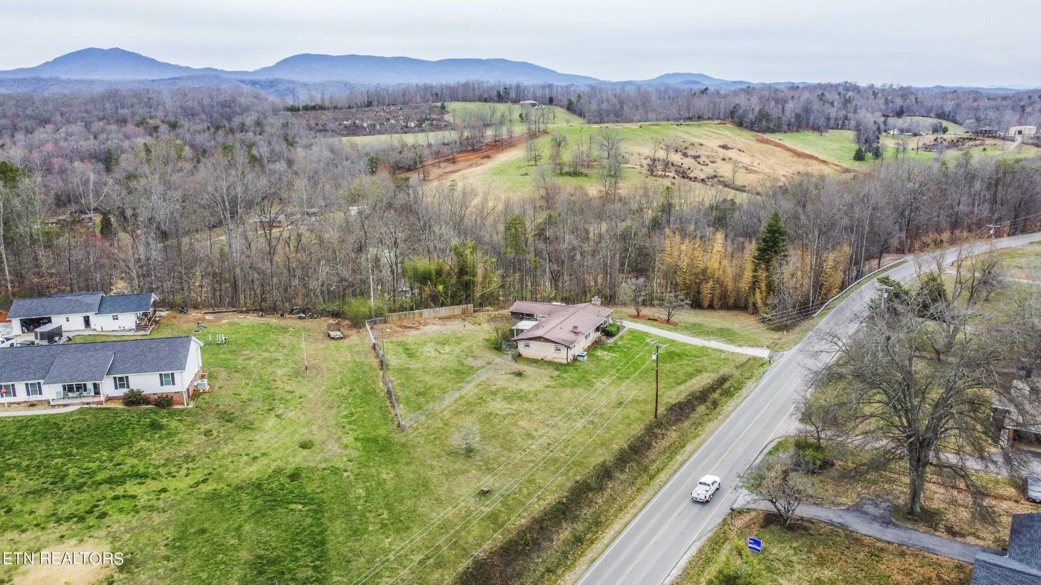 1280 Laurel Road Clinton, TN 37716 - Photo 35 of 36 a view of a lush green hillside and houses