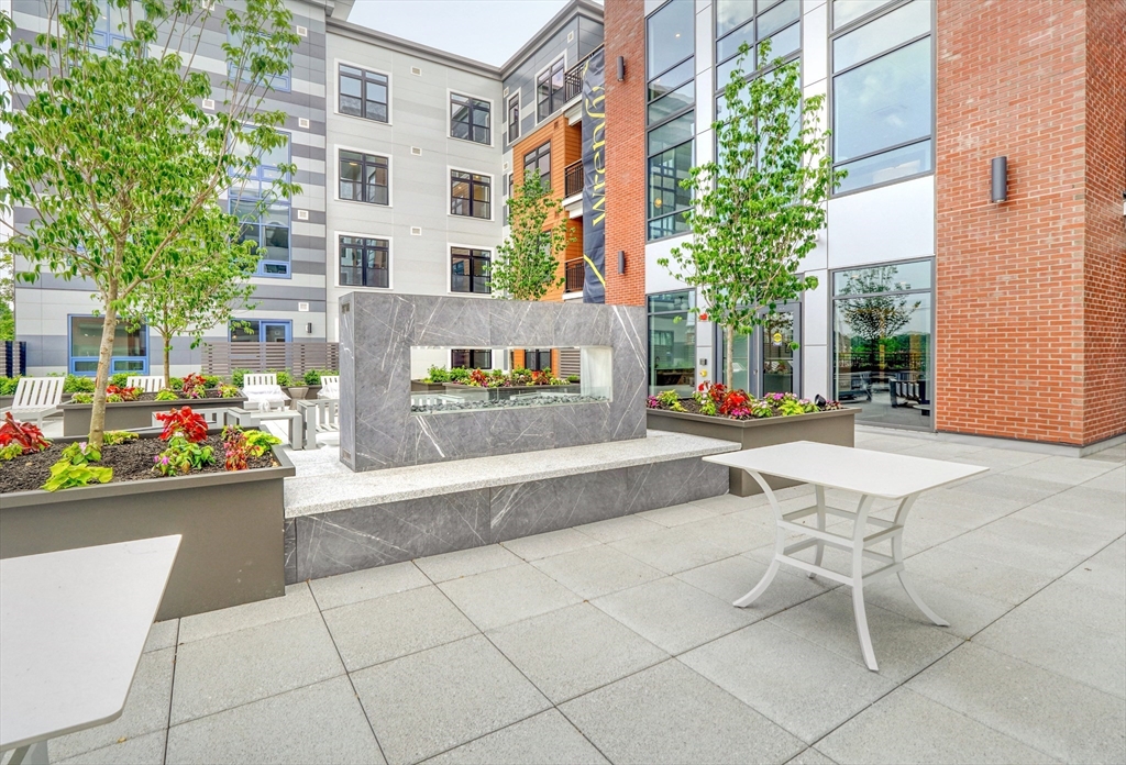 62 Foundry Street, Unit 414 Wakefield, MA 01880 - Photo 14 of 24 a view of a building with sitting area