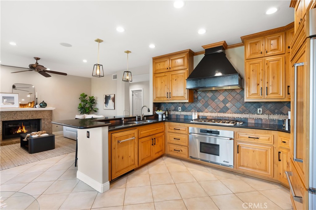 8 Rimani Drive Mission Viejo, CA 92692 - Photo 11 of 56 a kitchen with stainless steel appliances granite countertop a sink and cabinets