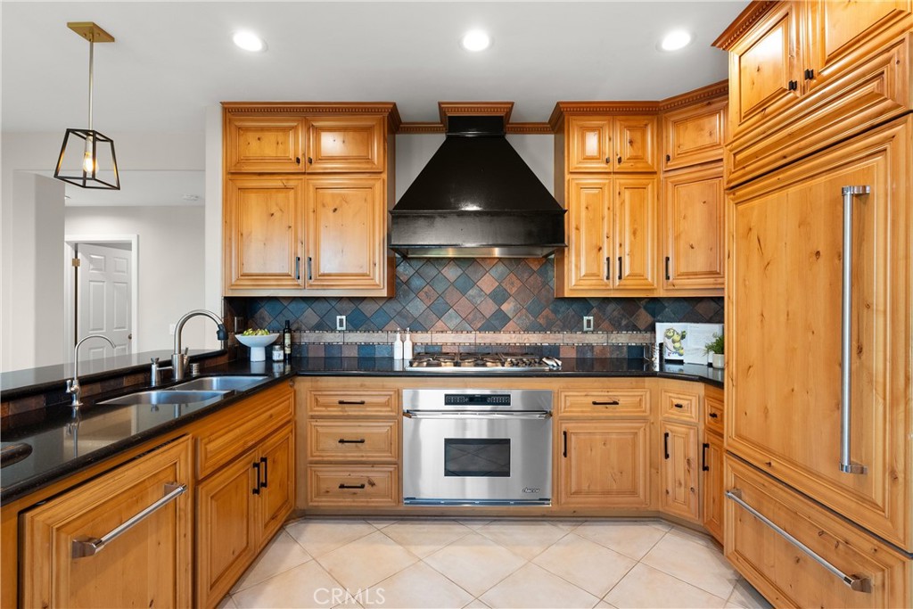 8 Rimani Drive Mission Viejo, CA 92692 - Photo 12 of 56 a kitchen with stainless steel appliances granite countertop white cabinets granite counter tops and a window