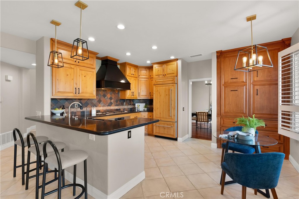 8 Rimani Drive Mission Viejo, CA 92692 - Photo 13 of 56 a kitchen with stainless steel appliances granite countertop a stove a sink and a refrigerator