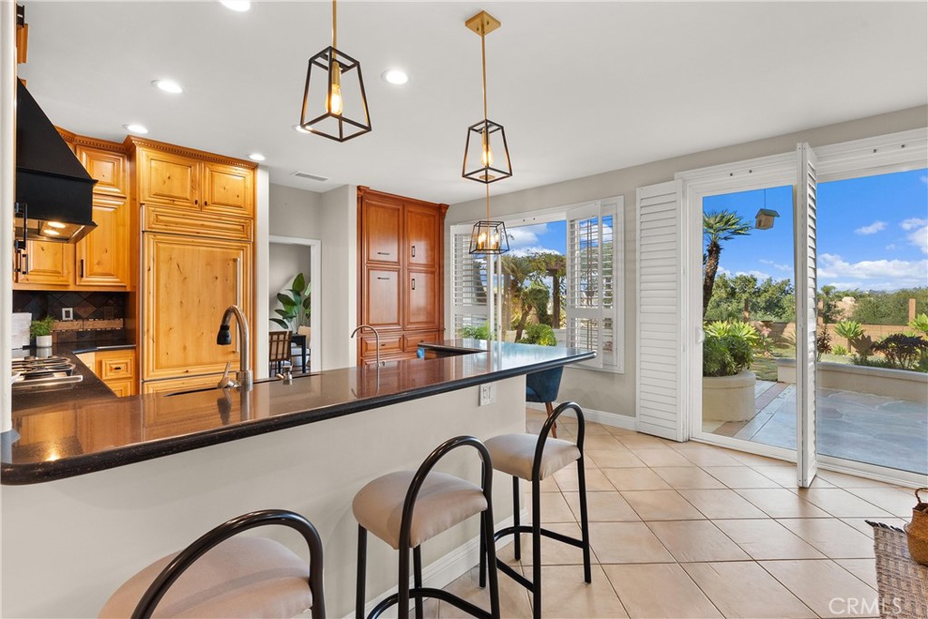8 Rimani Drive Mission Viejo, CA 92692 - Photo 14 of 56 a dining room with stainless steel appliances granite countertop furniture a window and kitchen view