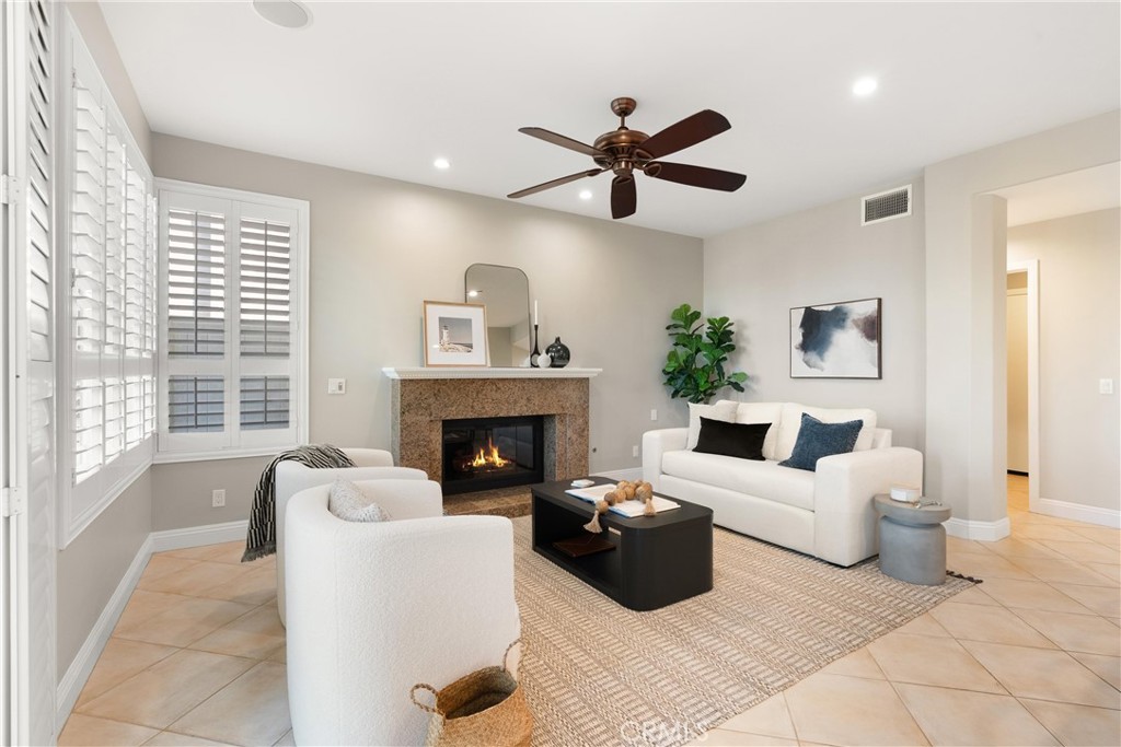 8 Rimani Drive Mission Viejo, CA 92692 - Photo 16 of 56 a living room with furniture and a fireplace