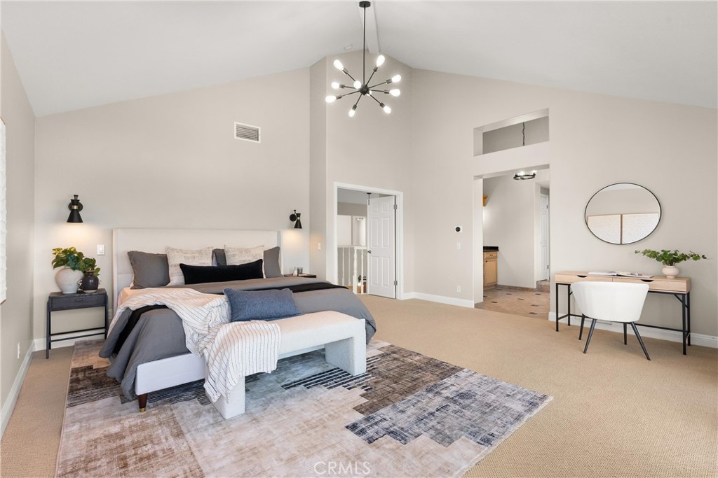 8 Rimani Drive Mission Viejo, CA 92692 - Photo 23 of 56 a living room with furniture a large mirror and a table