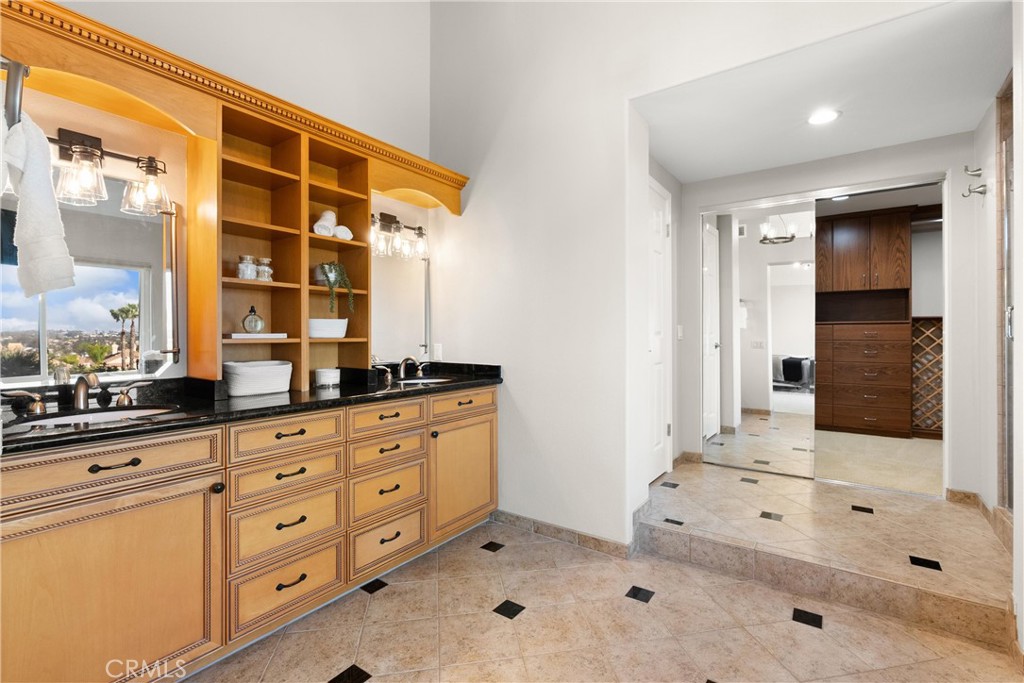 8 Rimani Drive Mission Viejo, CA 92692 - Photo 25 of 56 a spacious bathroom with double vanity and a mirror