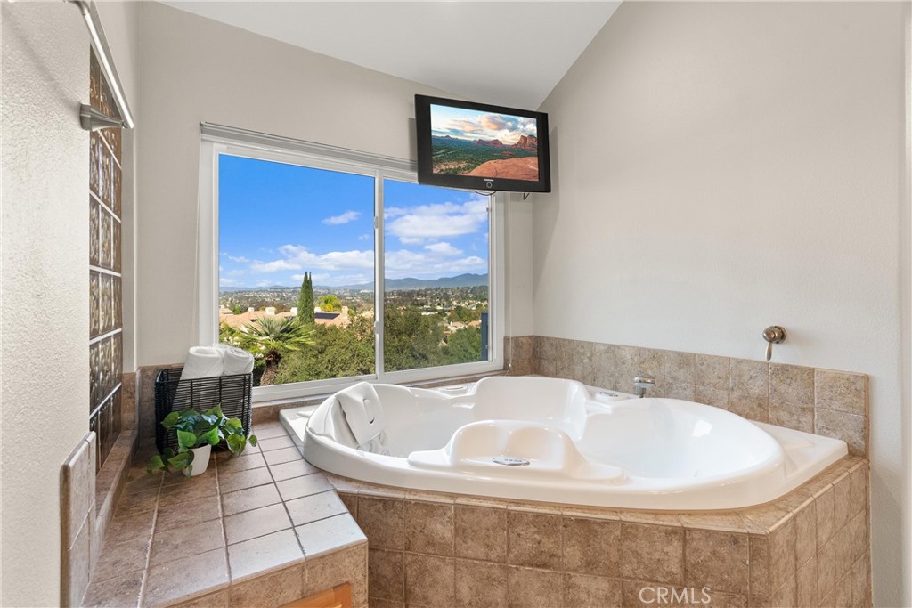 8 Rimani Drive Mission Viejo, CA 92692 - Photo 27 of 56 a bath tub sitting in a bathroom next to a window