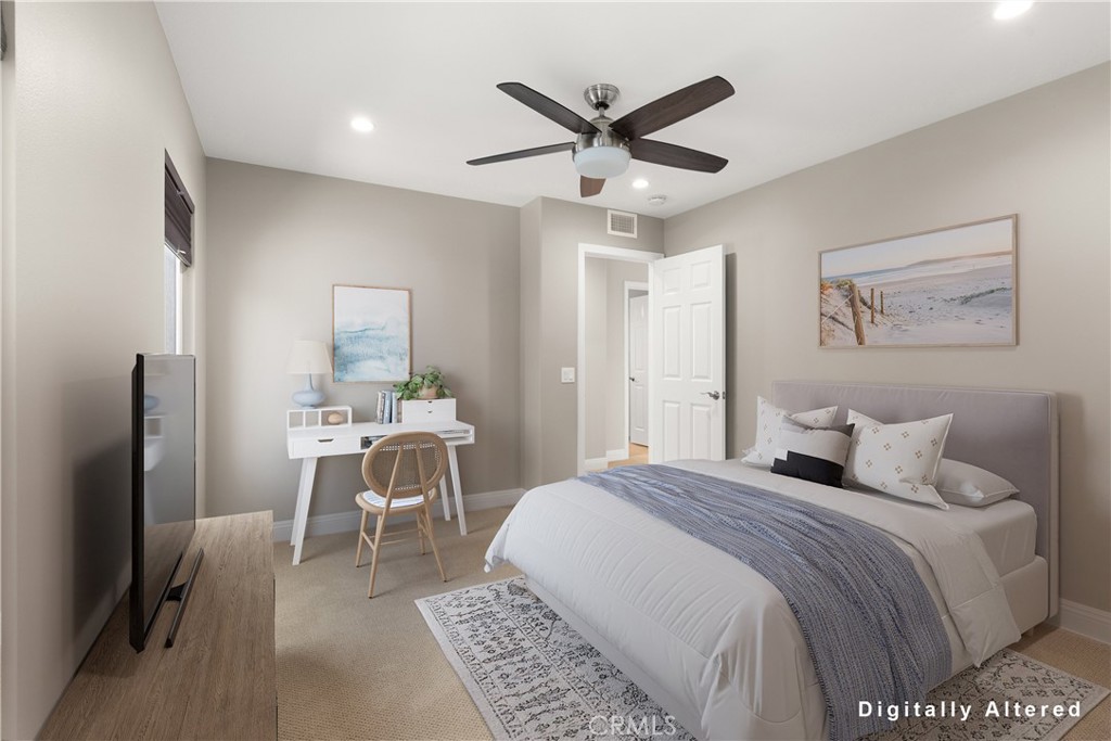 8 Rimani Drive Mission Viejo, CA 92692 - Photo 35 of 56 a bedroom with a large bed and a chandelier