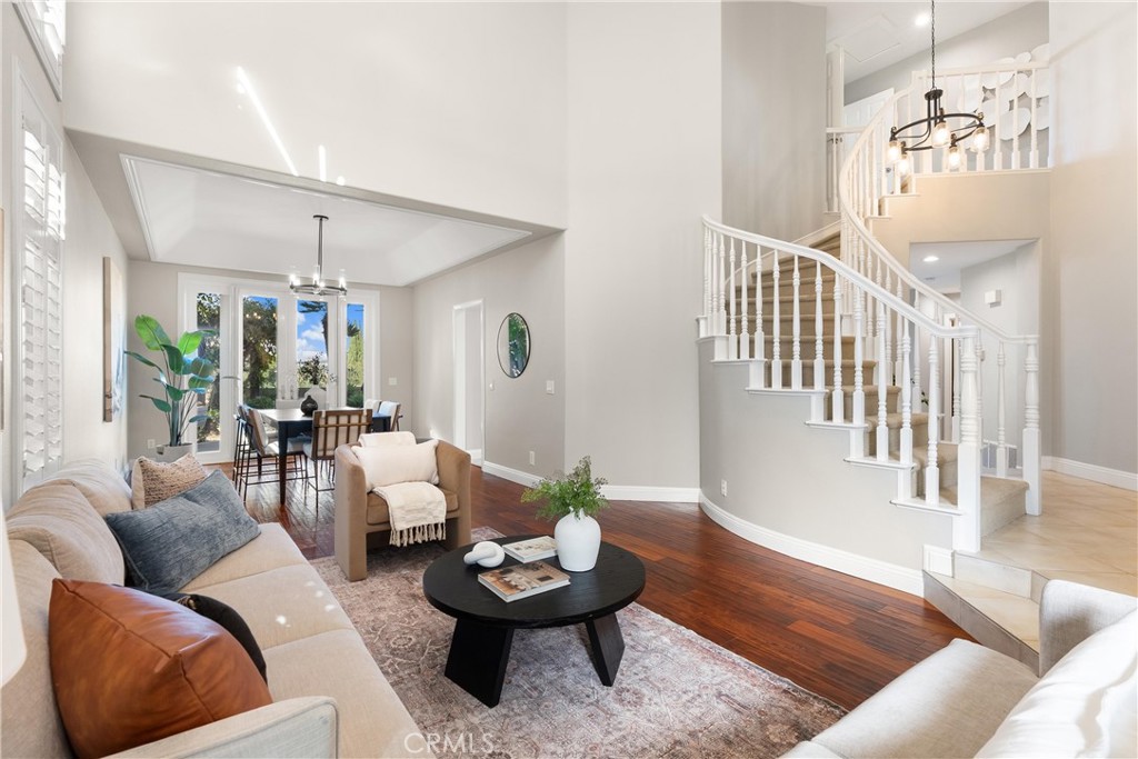 8 Rimani Drive Mission Viejo, CA 92692 - Photo 4 of 56 a living room with furniture and a chandelier