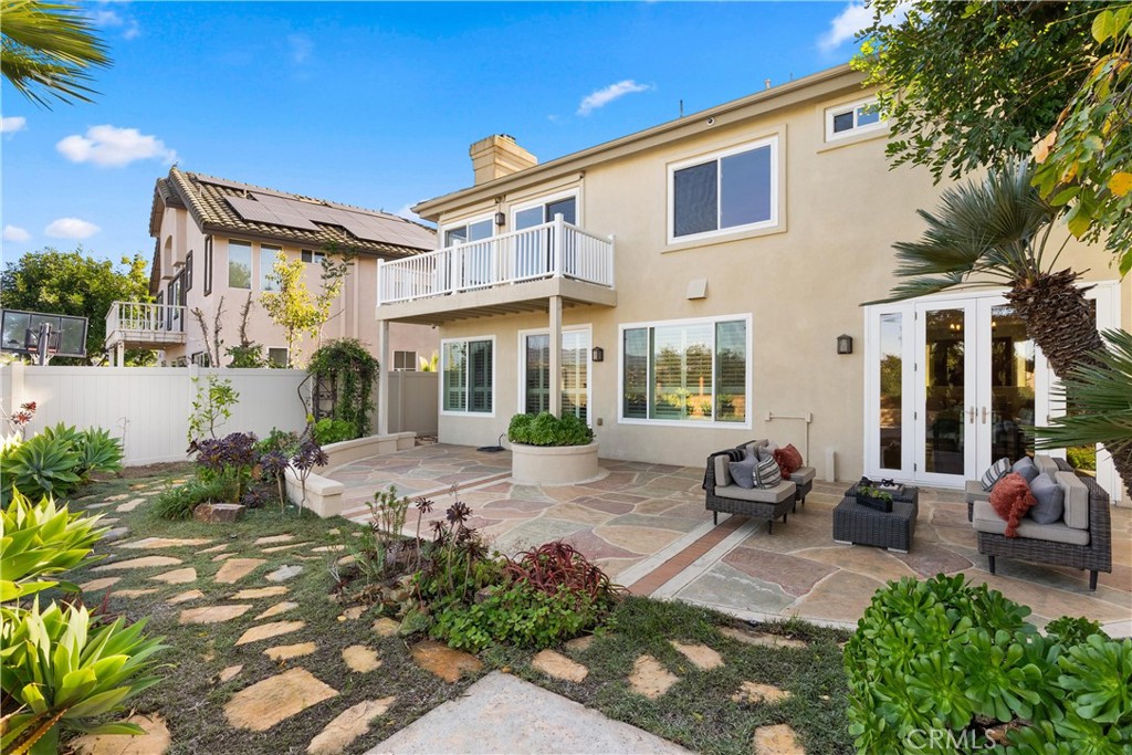 8 Rimani Drive Mission Viejo, CA 92692 - Photo 43 of 56 a view of a house with backyard sitting area and porch