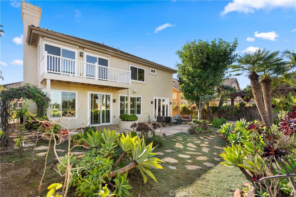 8 Rimani Drive Mission Viejo, CA 92692 - Photo 45 of 56 a front view of a house with a yard