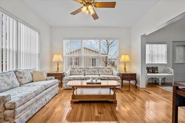 a living room with furniture and a large window