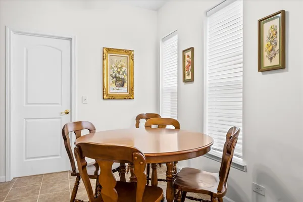 a view of a dining room that has a table and chairs