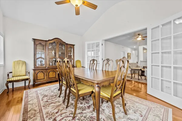 a dining room with furniture and window