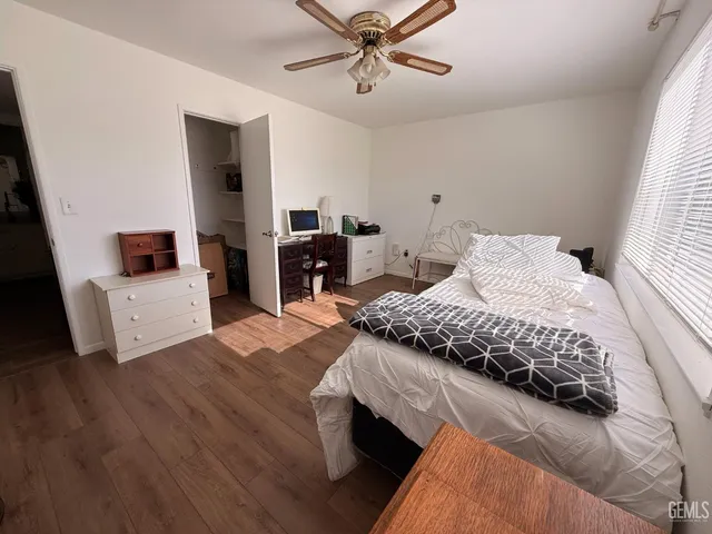 a bathroom with a sink toilet vanity and shower