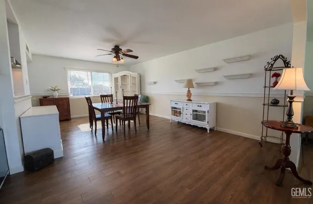 a view of a dining room with furniture and wooden floor
