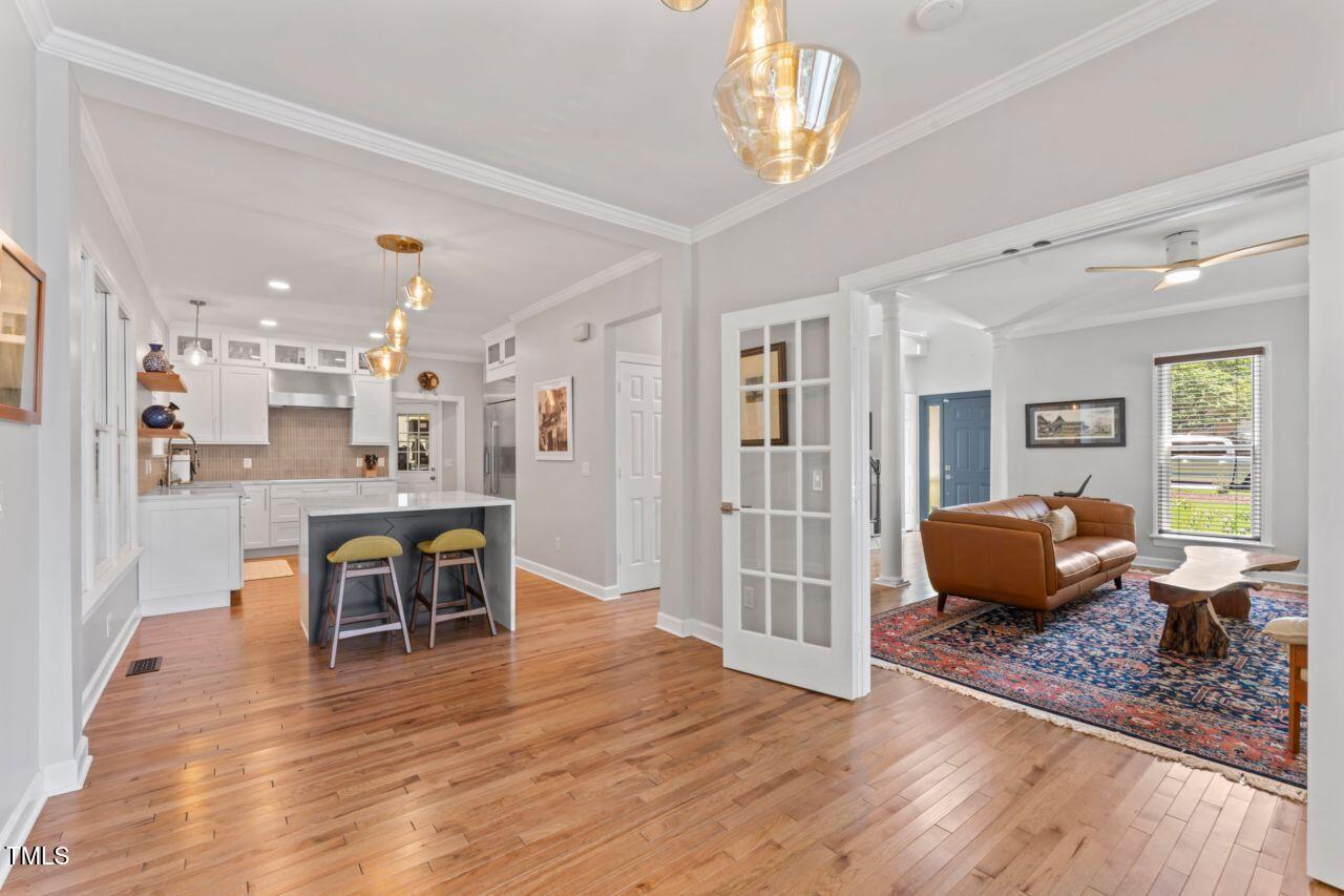 4408 Queenstown Court Raleigh, NC 27612 - Photo 13 of 49 a living room with furniture and a wooden floor