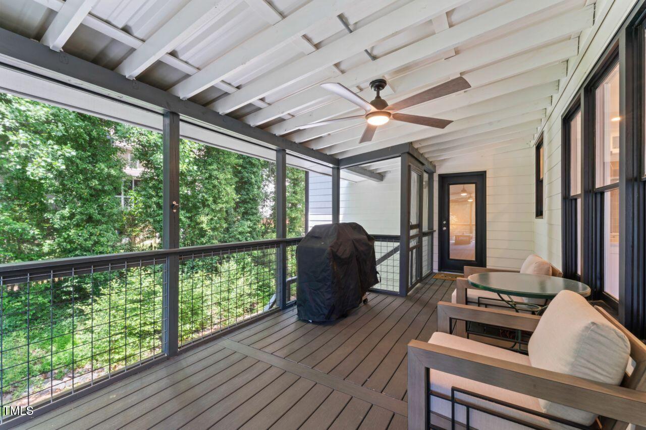 4408 Queenstown Court Raleigh, NC 27612 - Photo 21 of 49 a living room with furniture and a large window