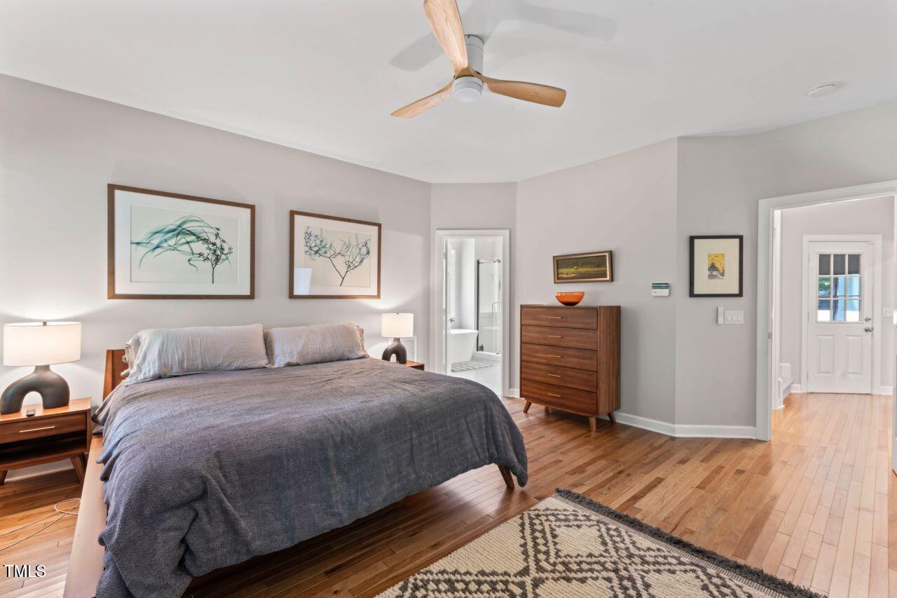 4408 Queenstown Court Raleigh, NC 27612 - Photo 23 of 49 a bedroom with a bed and a couch