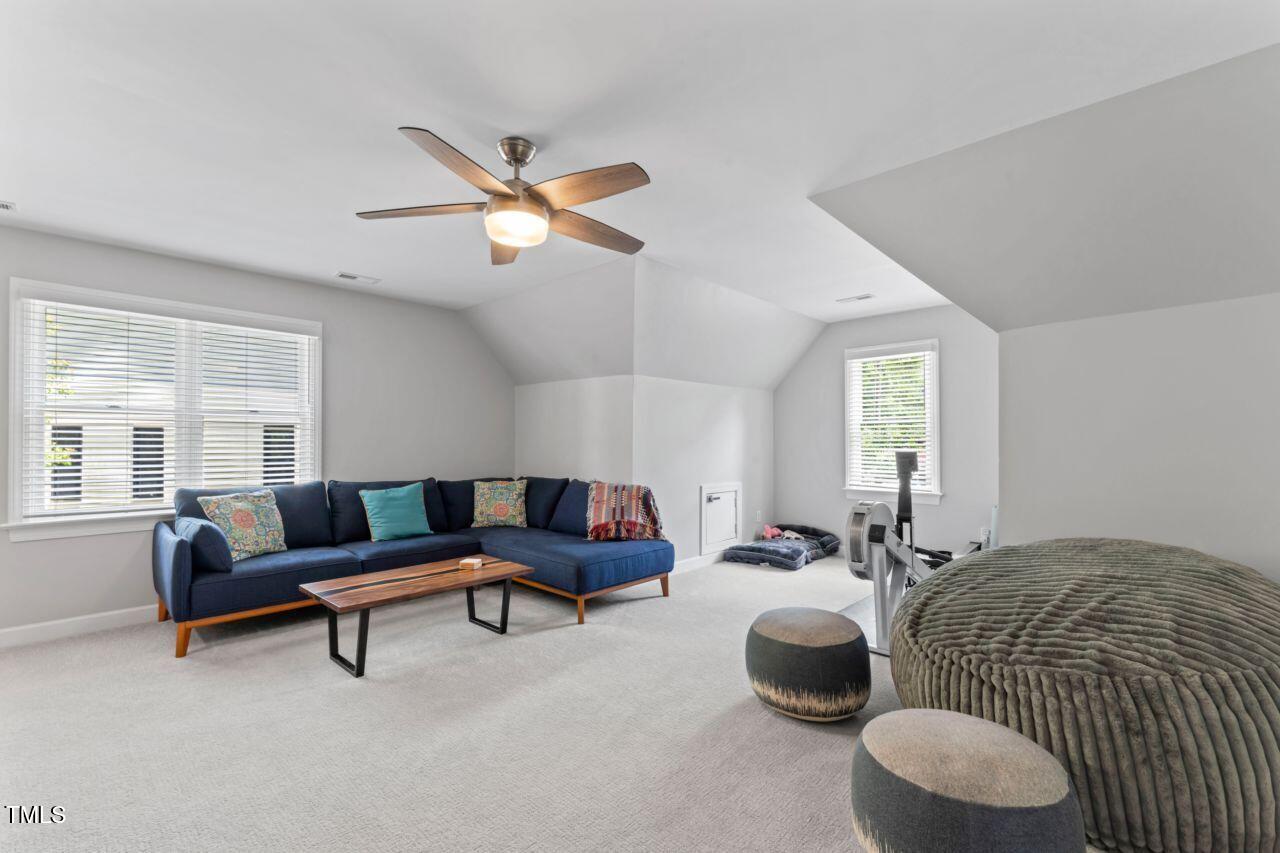 4408 Queenstown Court Raleigh, NC 27612 - Photo 28 of 49 a living room with furniture and a large window