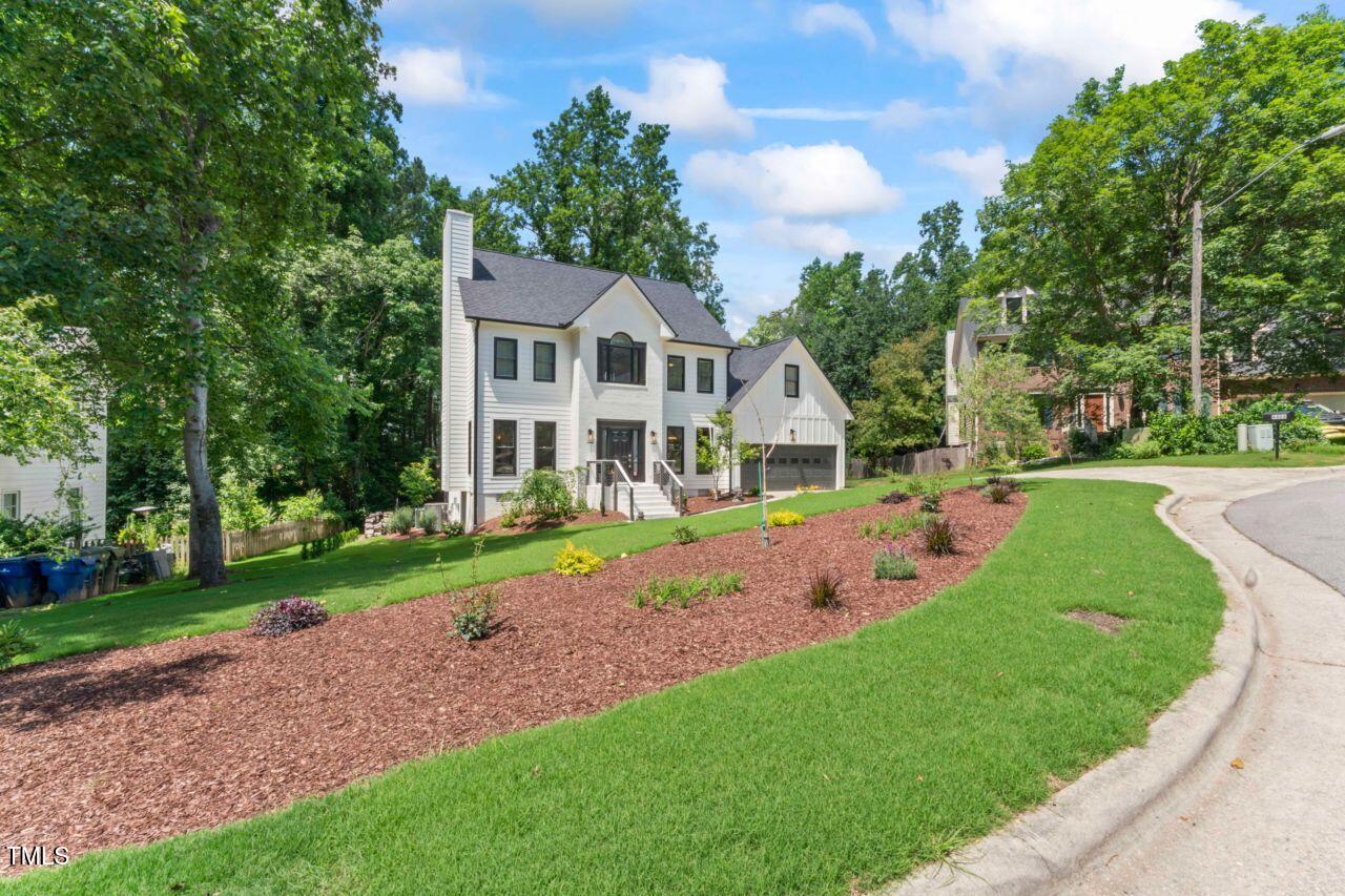 4408 Queenstown Court Raleigh, NC 27612 - Photo 2 of 49 a view of a house with a yard