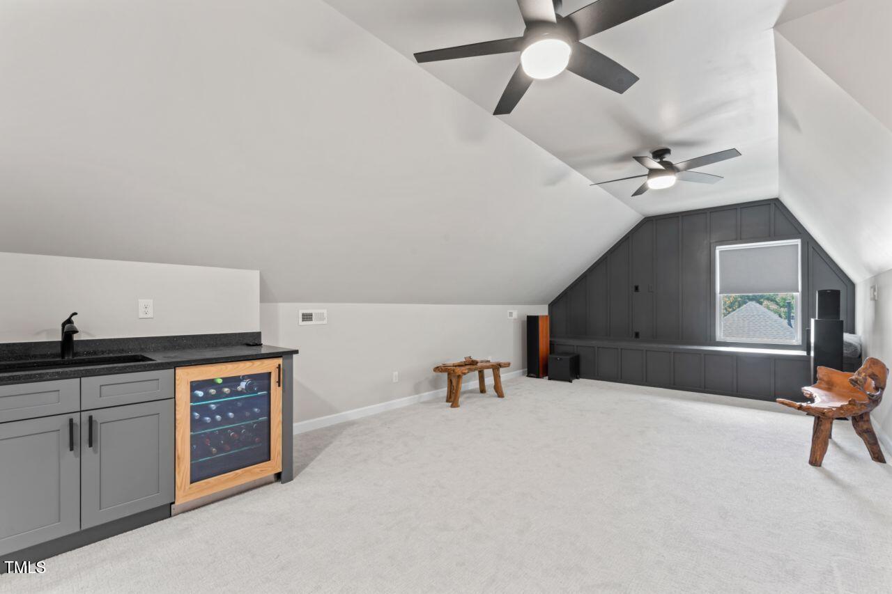 4408 Queenstown Court Raleigh, NC 27612 - Photo 31 of 49 a living room with furniture and a ceiling fan