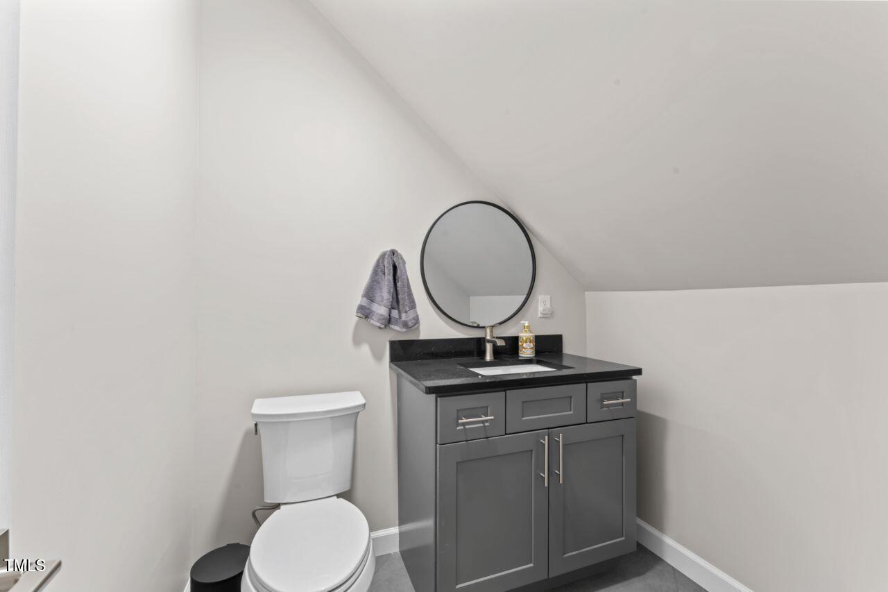 4408 Queenstown Court Raleigh, NC 27612 - Photo 33 of 49 a bathroom with a toilet and a sink