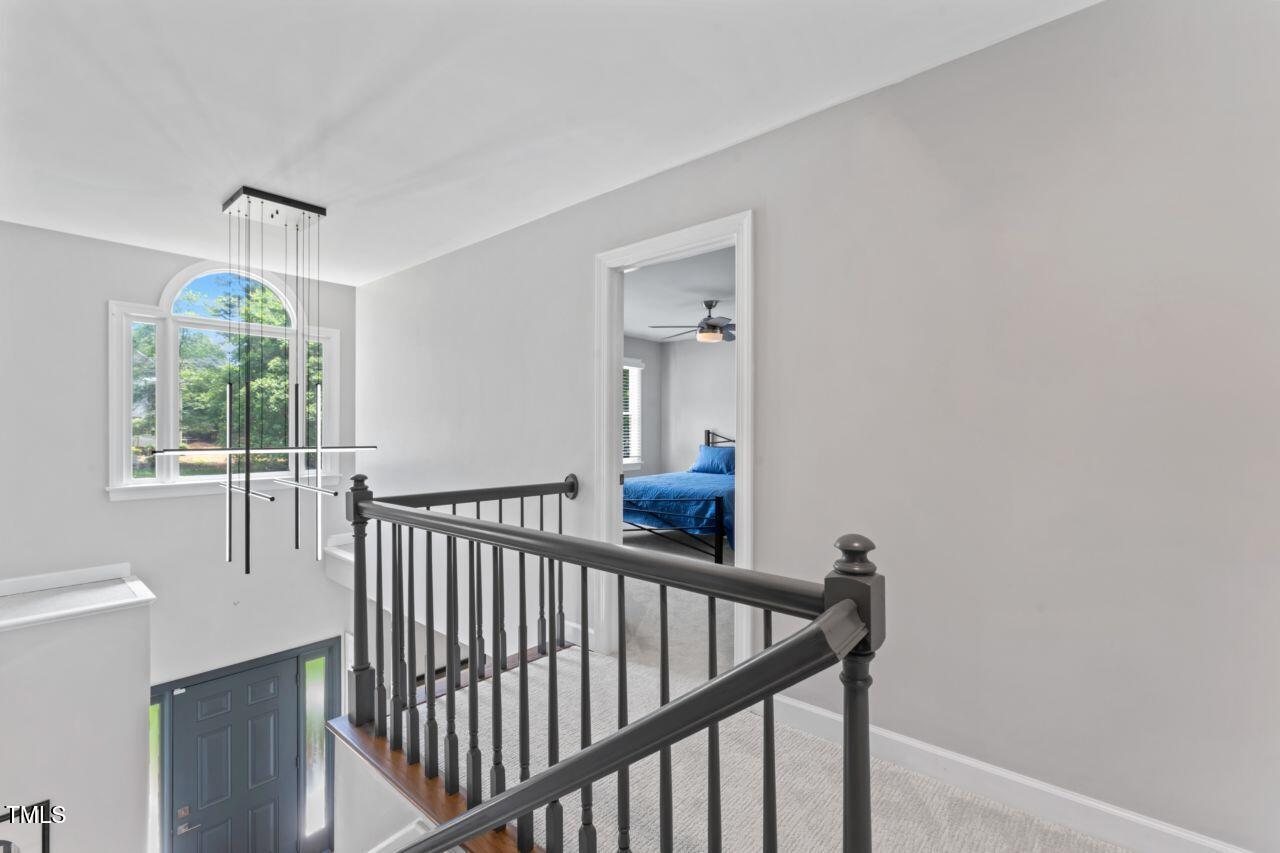 4408 Queenstown Court Raleigh, NC 27612 - Photo 34 of 49 a view of a hallway with windows