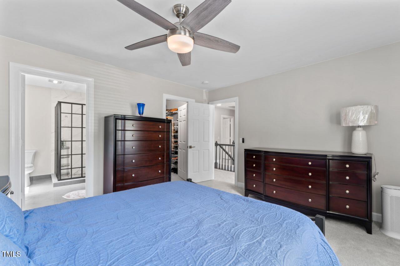 4408 Queenstown Court Raleigh, NC 27612 - Photo 35 of 49 a bedroom with a bed and a dresser