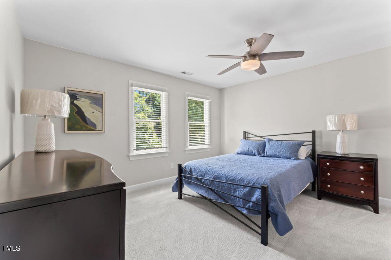 4408 Queenstown Court Raleigh, NC 27612 - Photo 36 of 49 a bedroom with a bed and a couch