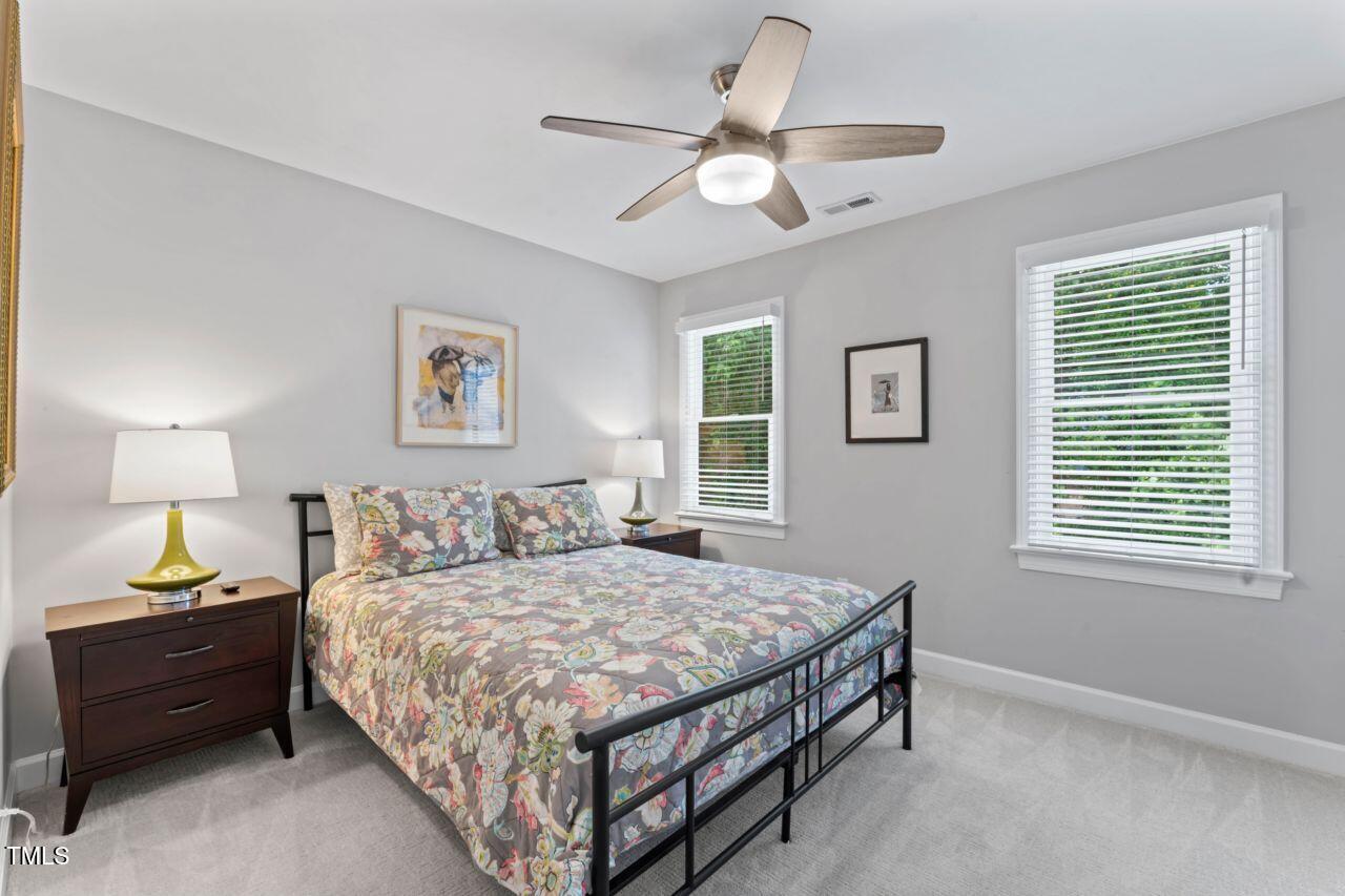 4408 Queenstown Court Raleigh, NC 27612 - Photo 38 of 49 a bedroom with a bed and a window
