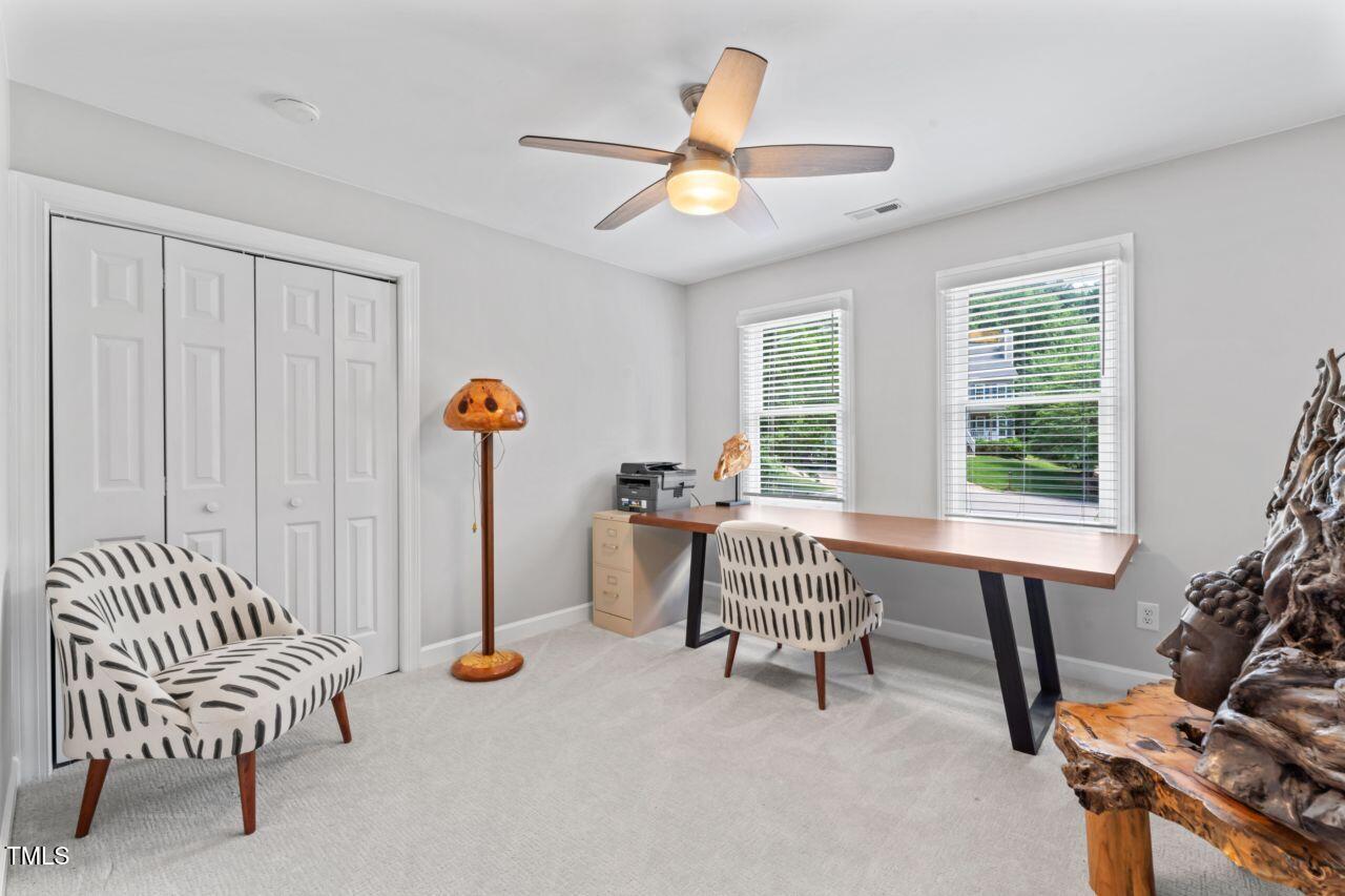 4408 Queenstown Court Raleigh, NC 27612 - Photo 39 of 49 a living room with furniture and a window