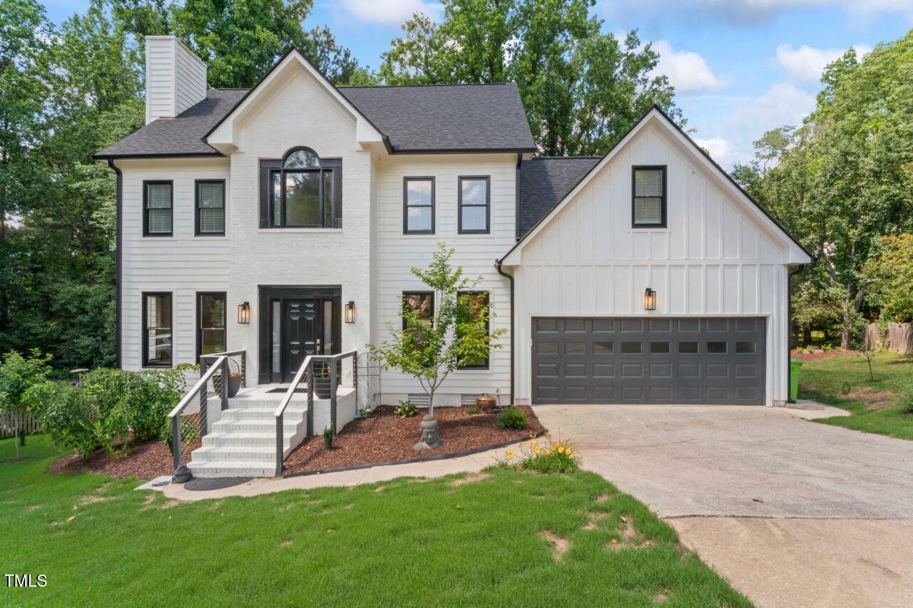 4408 Queenstown Court Raleigh, NC 27612 - Photo 47 of 49 a front view of a house with a yard