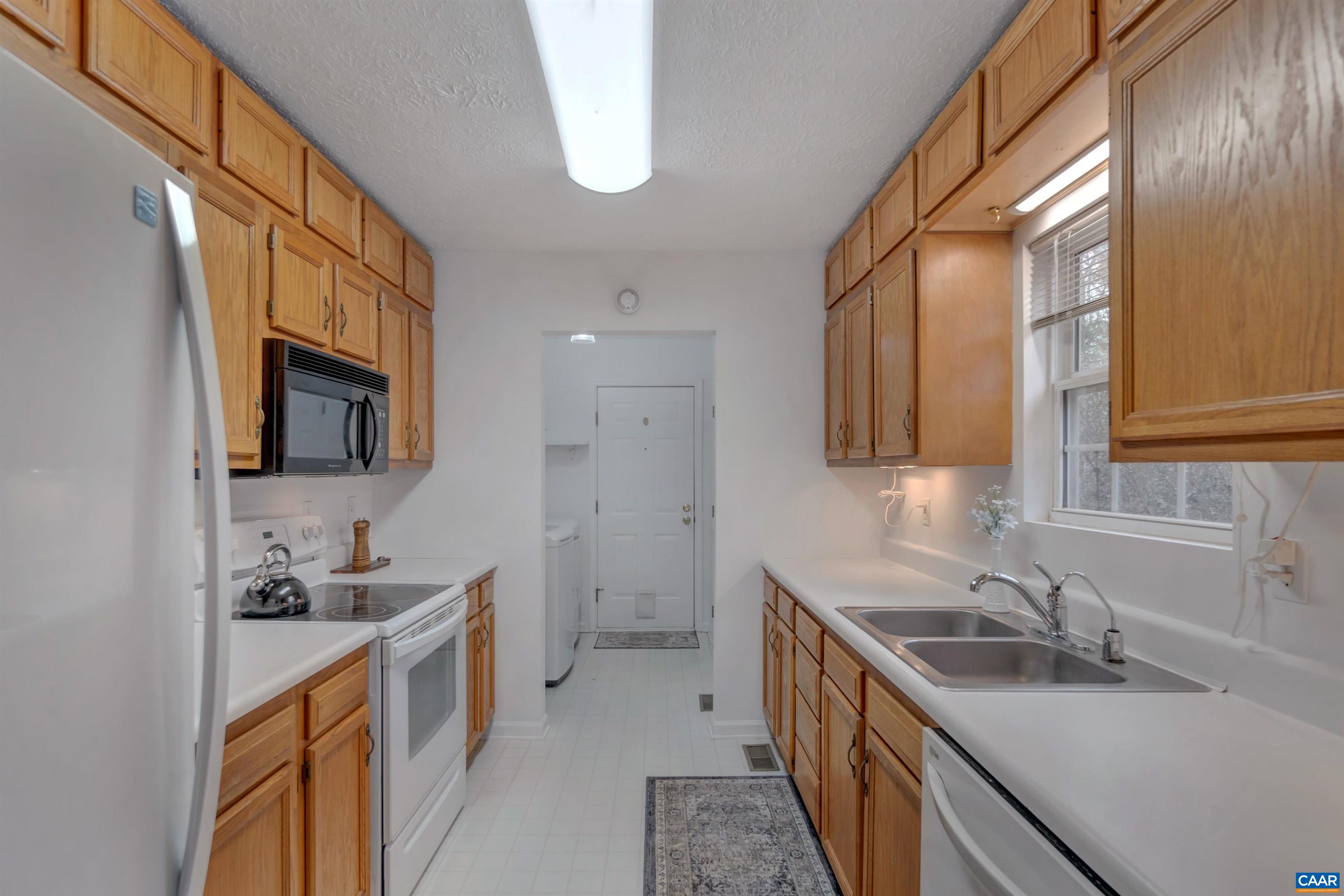 415 Rudolph Street Ruckersville, VA 22968 - Photo 14 of 38 a kitchen with a sink stove top oven and refrigerator