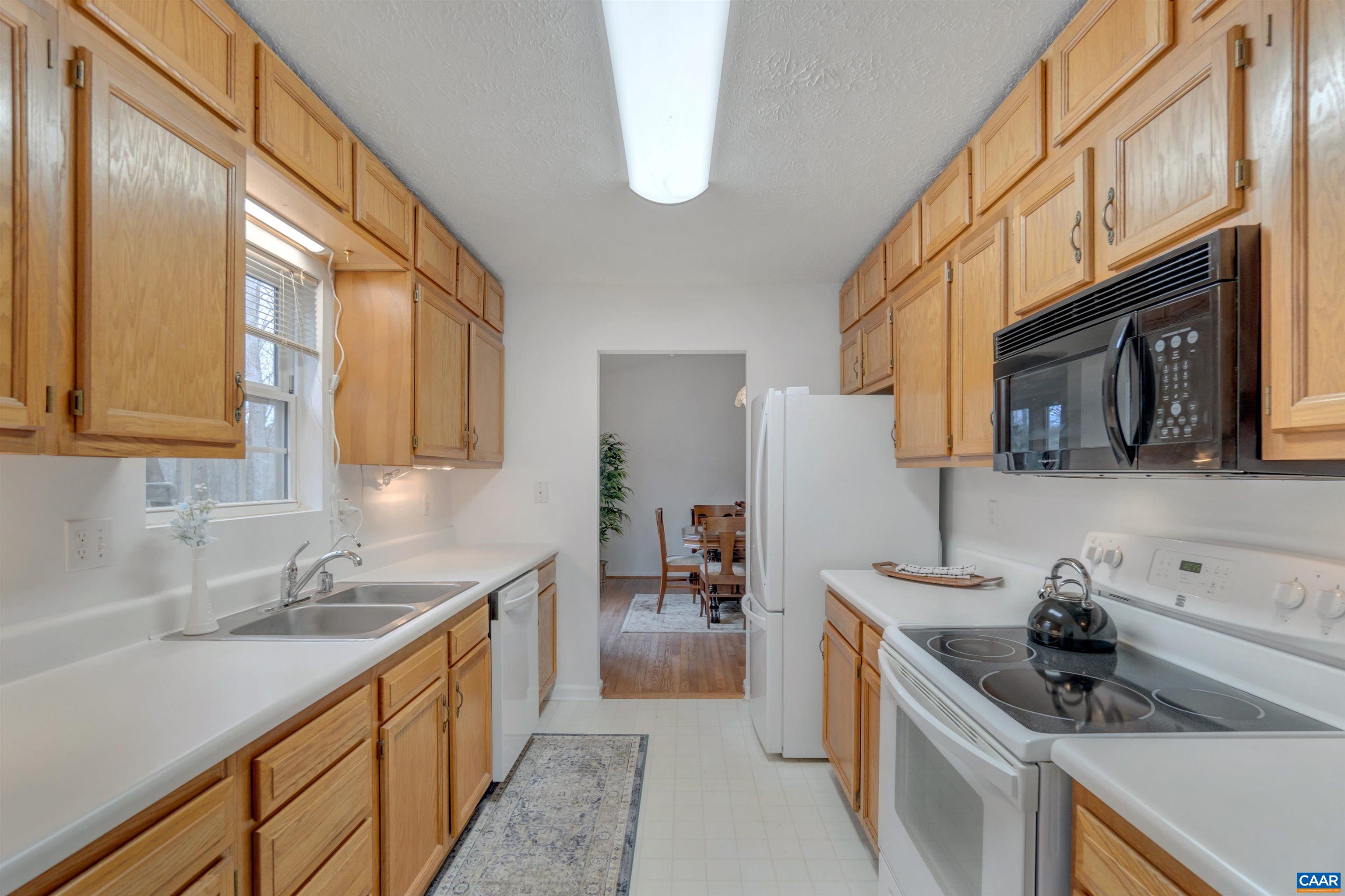 415 Rudolph Street Ruckersville, VA 22968 - Photo 17 of 38 a kitchen with a sink and a stove top oven